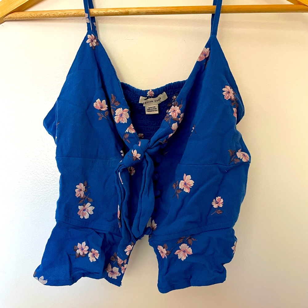 Blue crop top, fitted on top with flowy bottom. Adjustable straps